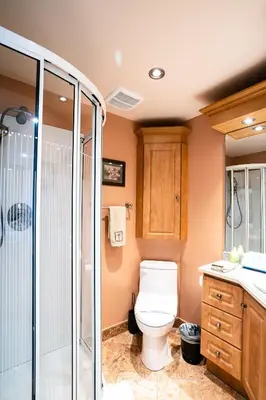 a bathroom with a toilet and a shower at Le Cartier Apartments Sunny Isles in Sunny Isles Beach