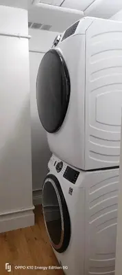 a microwave oven sitting on top of a refrigerator at Edercozy in Miami
