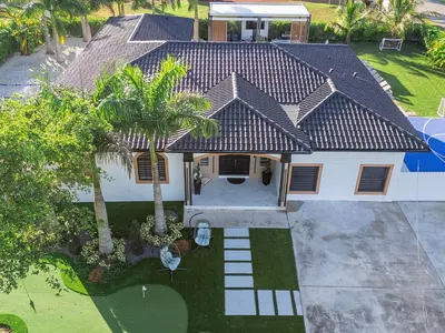 an overhead view of a house with palm trees at Villa ART Pool Golf Volleyball in Miami