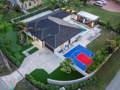 an overhead view of a house with a basketball court at Villa ART Pool Golf Volleyball in Miami