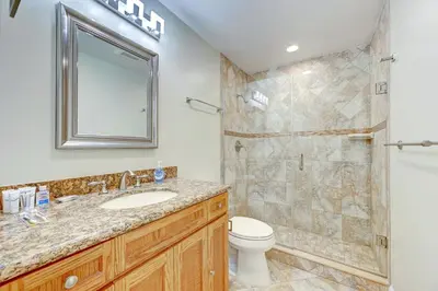 a bathroom with a toilet and a sink and a shower at Tropical Oasis 6BR & 4BR Villa Heated Pool & Billiard Room in Hollywood