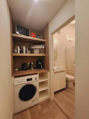 a kitchen with a washer and dryer in a room at Private Home Studio Central Located in Miami 2 in Opa-locka