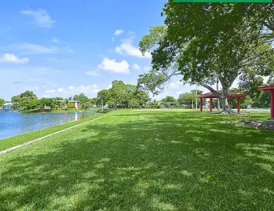 a green park with a tree and a gazebo at 1233 Apartment 1 Miami in Tamiami