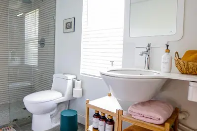 a white bathroom with a sink and a toilet at New Nordic Touch Loft, Central Location in Miami