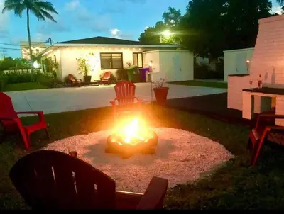a fire pit in the backyard of a house at Charming house Miami in Miami
