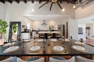 a dining room with a table and some chairs at Waterfront - Kayak & Paddleboards - Firepit - Pool in Miami