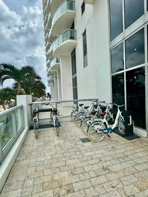 a group of bikes parked outside of a building at Marena Resort in Sunny Isles Beach