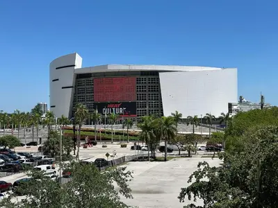a large building with a parking lot in front of it at Suite Azul Miami - Private Guest Suite with Patio, Free Parking, Near Wynwood and Beaches in Miami