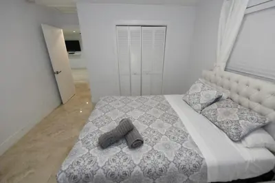 a bedroom with a large bed with a large window at N61 in Hollywood