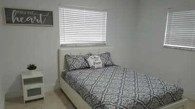 a bedroom with a bed and a sign on the wall at N61 in Hollywood