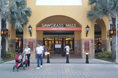 a group of people standing in front of a mall entry at King Bed, 3 miles to Stadium in Miami Gardens