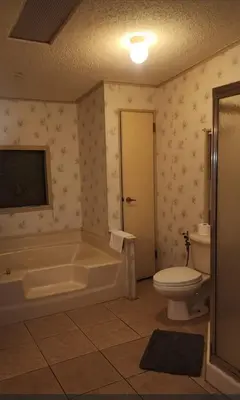 a bathroom with a tub and a toilet and a sink at 1233 Apartment 2 Miami in Tamiami