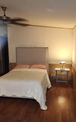 a bedroom with a large bed and a table at 1233 Apartment 2 Miami in Tamiami