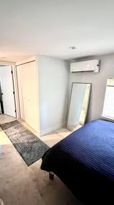 a bedroom with a blue bed in a room at Pool! Best location! Steps to the water! Kid friendly! in Miami