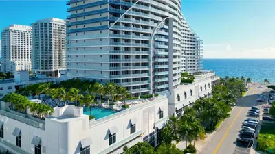an aerial view of a building and the ocean at Nautica - Ocean View & Rooftop Pools! by Newman Hospitality in Fort Lauderdale