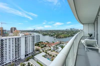 an apartment balcony with a view of a river at Nautica - Ocean View & Rooftop Pools! by Newman Hospitality in Fort Lauderdale