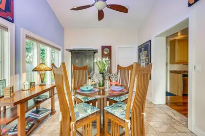 a dining room with a table and chairs and a ceiling fan at Fort Lauderdale Oasis with Pool about 2 Mi to Beach! in Fort Lauderdale