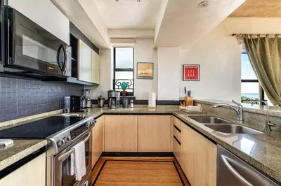 a large kitchen with a sink and a stove at The Netherland by MIAMI BEACH OCEAN RENTAL in Miami Beach