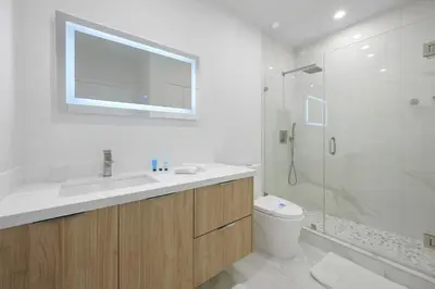 a bathroom with a toilet and a sink and a shower at Comfortable and broad apartment in O-Reserve near on the beach in Sunny Isles Beach