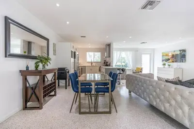 a living room with a couch and a table at Tropical Private Oasis Mins from Beach & Downtown in Miami