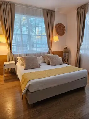 a bedroom with a large bed in front of a window at Bright 1BedRoom RENOVATED NEAR THE BEACH (4PPL) in Miami Beach