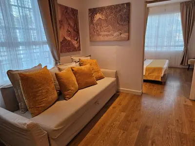 a living room with a couch with pillows at Bright 1BedRoom RENOVATED NEAR THE BEACH (4PPL) in Miami Beach