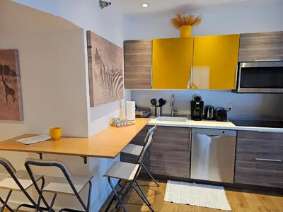 a kitchen with a table and chairs in a room at Bright 1BedRoom RENOVATED NEAR THE BEACH (4PPL) in Miami Beach