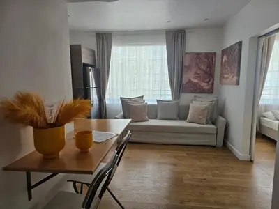 a living room with a couch and a table at Bright 1BedRoom RENOVATED NEAR THE BEACH (4PPL) in Miami Beach