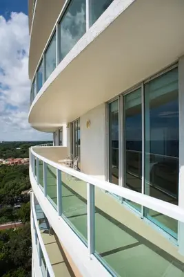 a balcony of a building with glass windows at Coconut Grove 2 bedroom Apartment Amazing Views Includes Parking in Miami