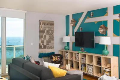 a living room with a couch and a tv at Coconut Grove 2 bedroom Apartment Amazing Views Includes Parking in Miami