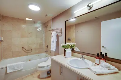 a bathroom with a sink and a toilet and a tub at Direct Bayview One Bedroom Condo in Coconut Grove Includes parking in Miami