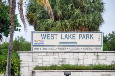 a sign for west lake park on a wall at Sheridan Suites Apartments in Dania Beach
