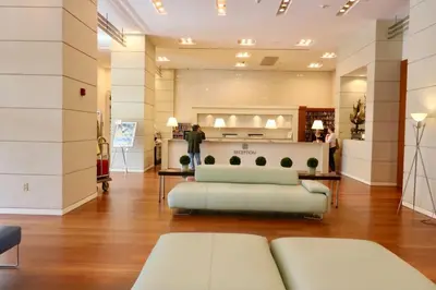 a living room with a couch and a table at Coconut Grove 10th Fl Studio Parking Included in Miami
