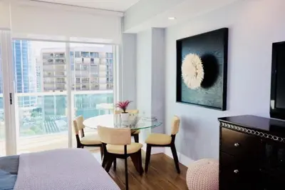 a room with a table and chairs and a dining room at Gorgeous Coconut Grove 3 bedroom Condo with amazing views Parking Included in Miami