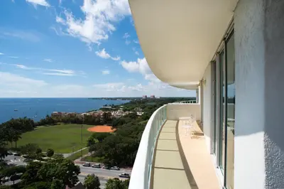 a balcony with a view of the ocean at Coconut Grove Gorgeous Bay View 1 bedroom Condo Includes Parking in Miami