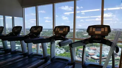 three treadmills in a gym looking out the window at Coconut Grove 21st Floor Private Studio-Parking & WIFI included in Miami