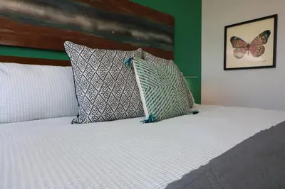 a bed with two pillows on top of it at Renovated 21st Floor Private Unit located in Coconut Grove Hotel in Miami