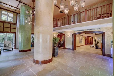 a large lobby with a large column in a building at Cute 1 bedroom unit located in Condo Hotel in the heart of Coconut Grove Free Parking in Miami