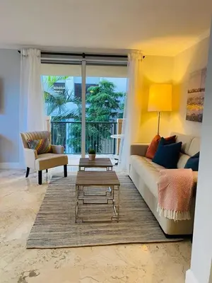 a living room with a couch and a coffee table at Cozy 1 bedroom unit located in a Condo Hotel in the heart of Coconut Grove Free Parking in Miami