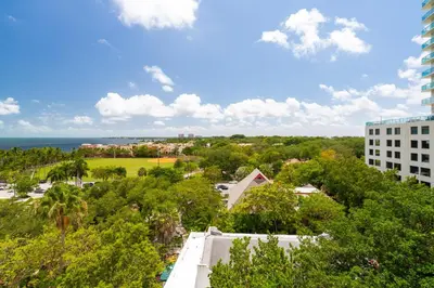 a view of the ocean from a building at Coconut Grove Retreat 1 bedroom apartment with Bay views in Miami