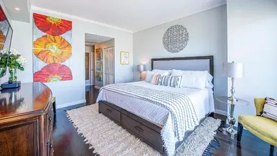 a bedroom with a bed and a dresser in it at Luxury Penthouse with Private Rooftop Terrace in Coconut Grove Hotel in Miami