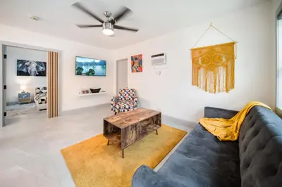 a living room with a couch and a table at Modern Apt Near Las Olas Beach in Fort Lauderdale