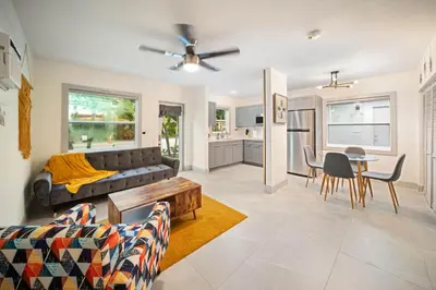 a living room with a couch and a table at Modern Apt Near Las Olas Beach in Fort Lauderdale