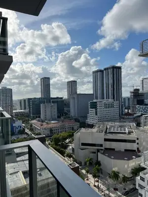 a view of a city from the balcony of a building at Modern Studio Downtown with Pool and Gym in Miami