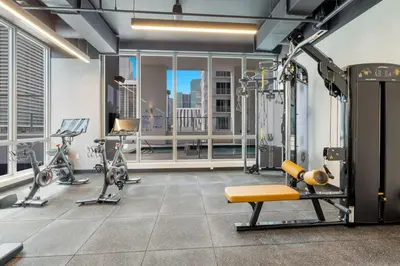 a gym with cardio equipment in a building at Downtown Luxury Studio Pool and Gym in Miami