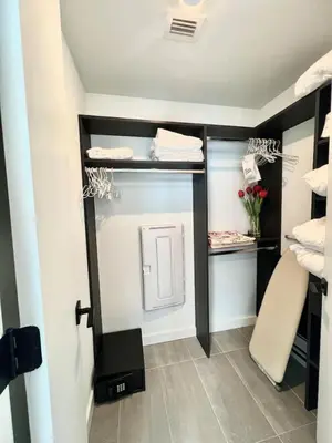a room with a walk in closet with at Ocean view Studio Pool and gym in Miami