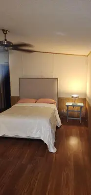 a bedroom with a large bed and a table at 1233 Apartment 3 Miami in Tamiami