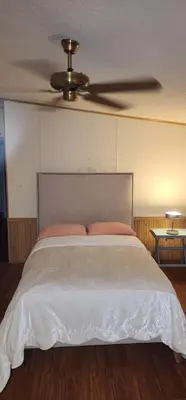 a bedroom with a bed with a ceiling fan at 1233 Apartment 3 Miami in Tamiami