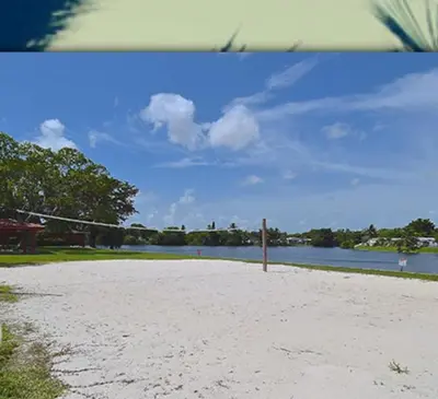 a sandy beach next to a body of water at 1233 Apartment 3 Miami in Tamiami