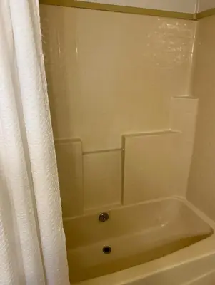 a bathroom with a tub and a shower curtain at 1233 Apartment 3 Miami in Tamiami